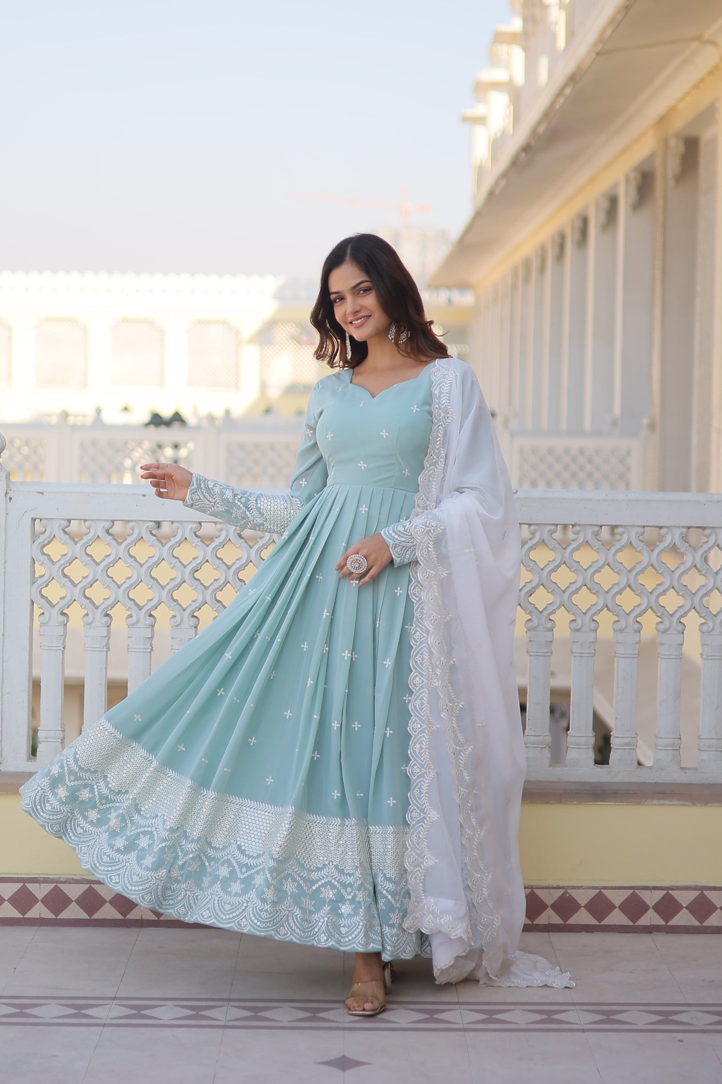 Faux georgette gown with sequins and thread work