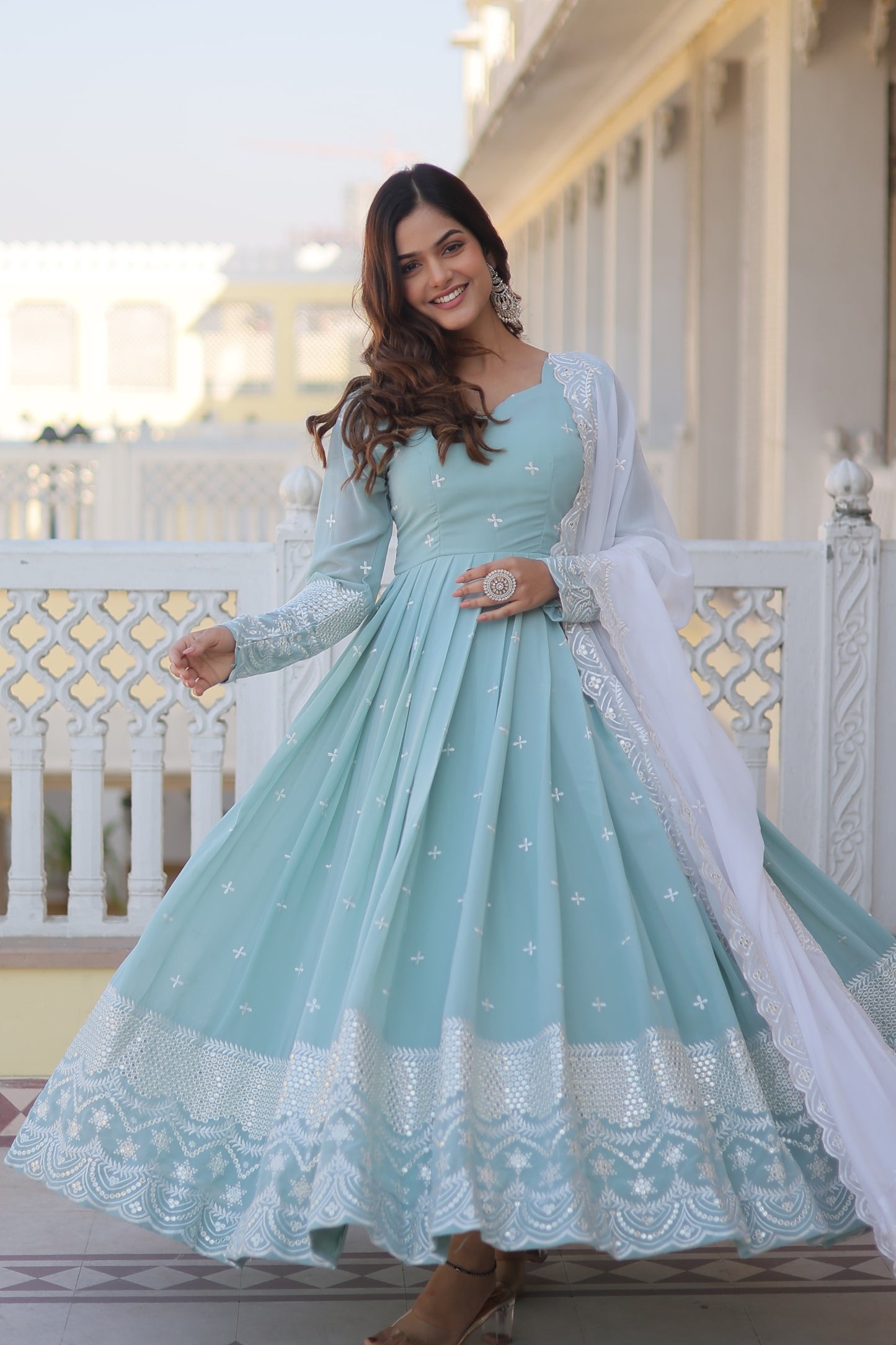 Faux georgette gown with sequins and thread work