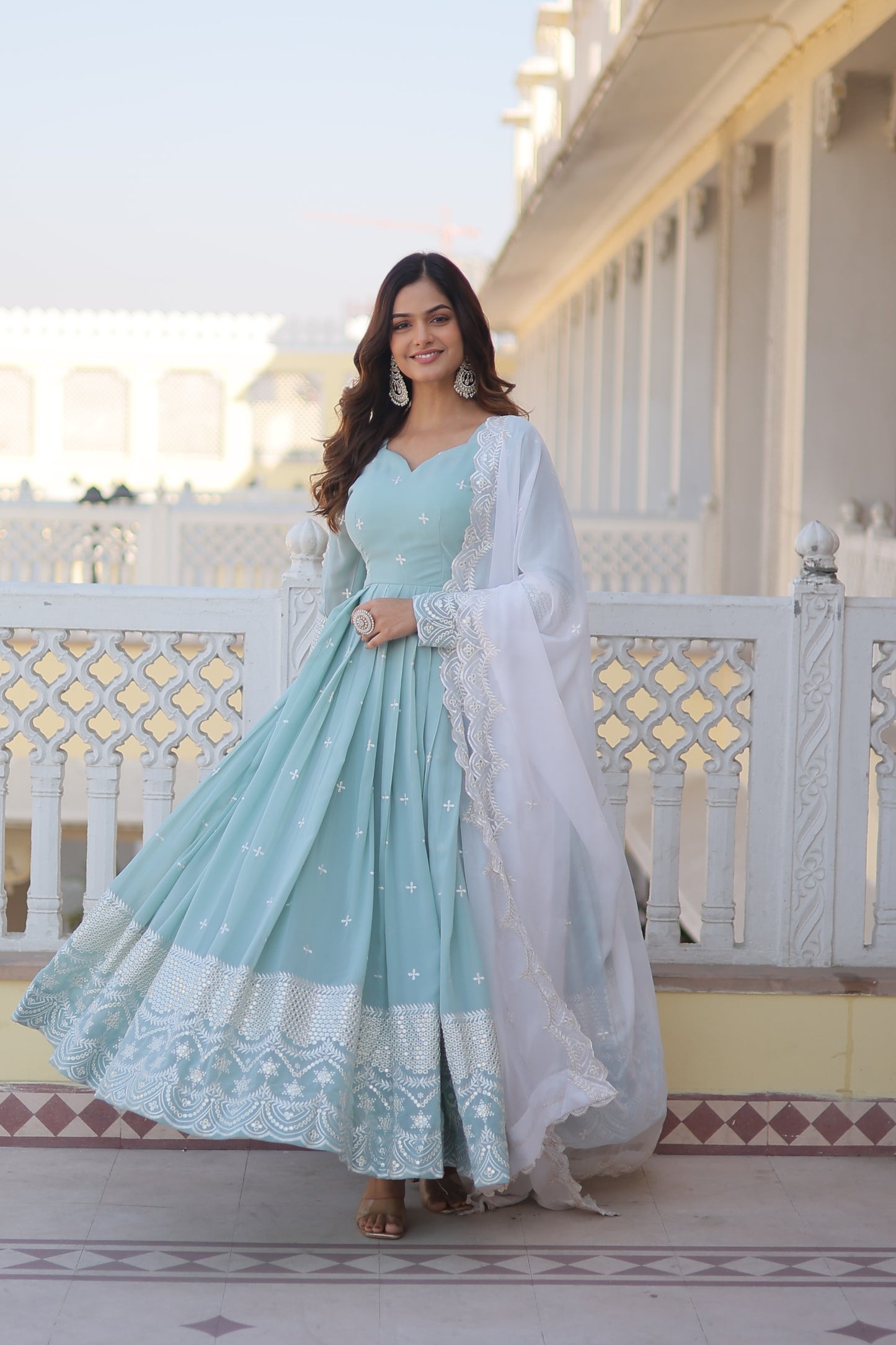 Faux georgette gown with sequins and thread work