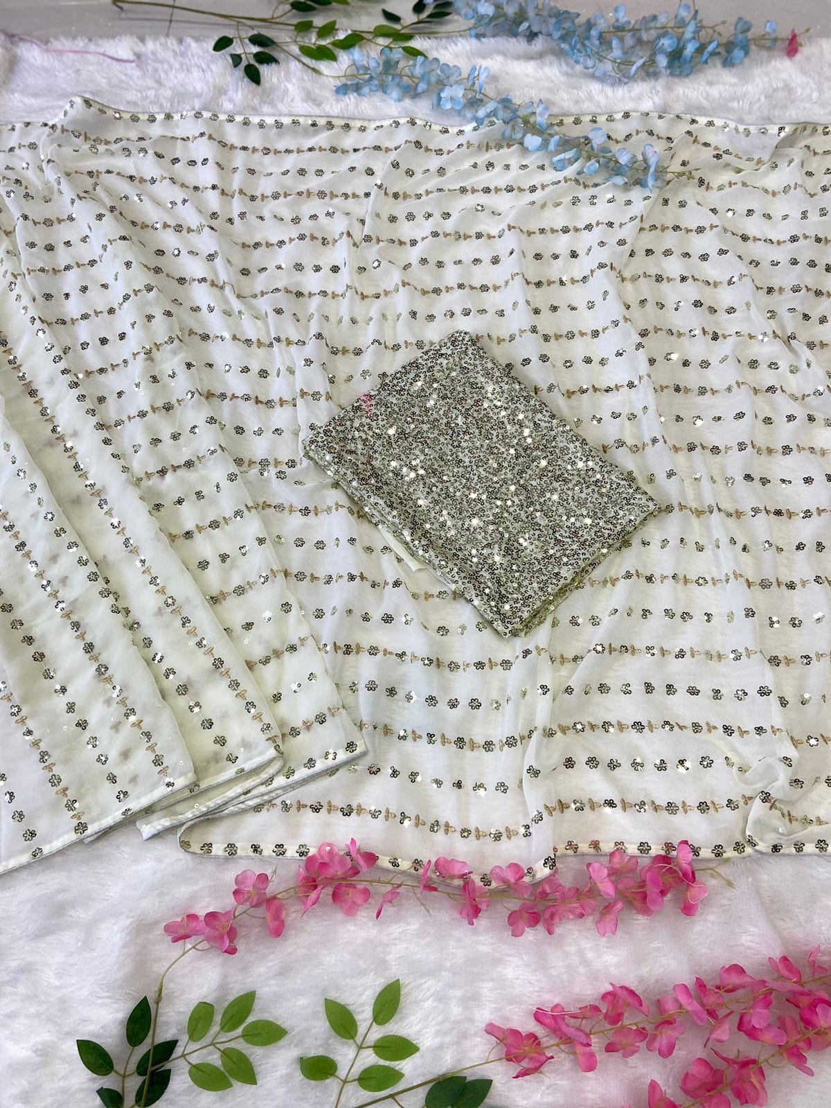 White saree with gold sequins work and heavy blouse piece