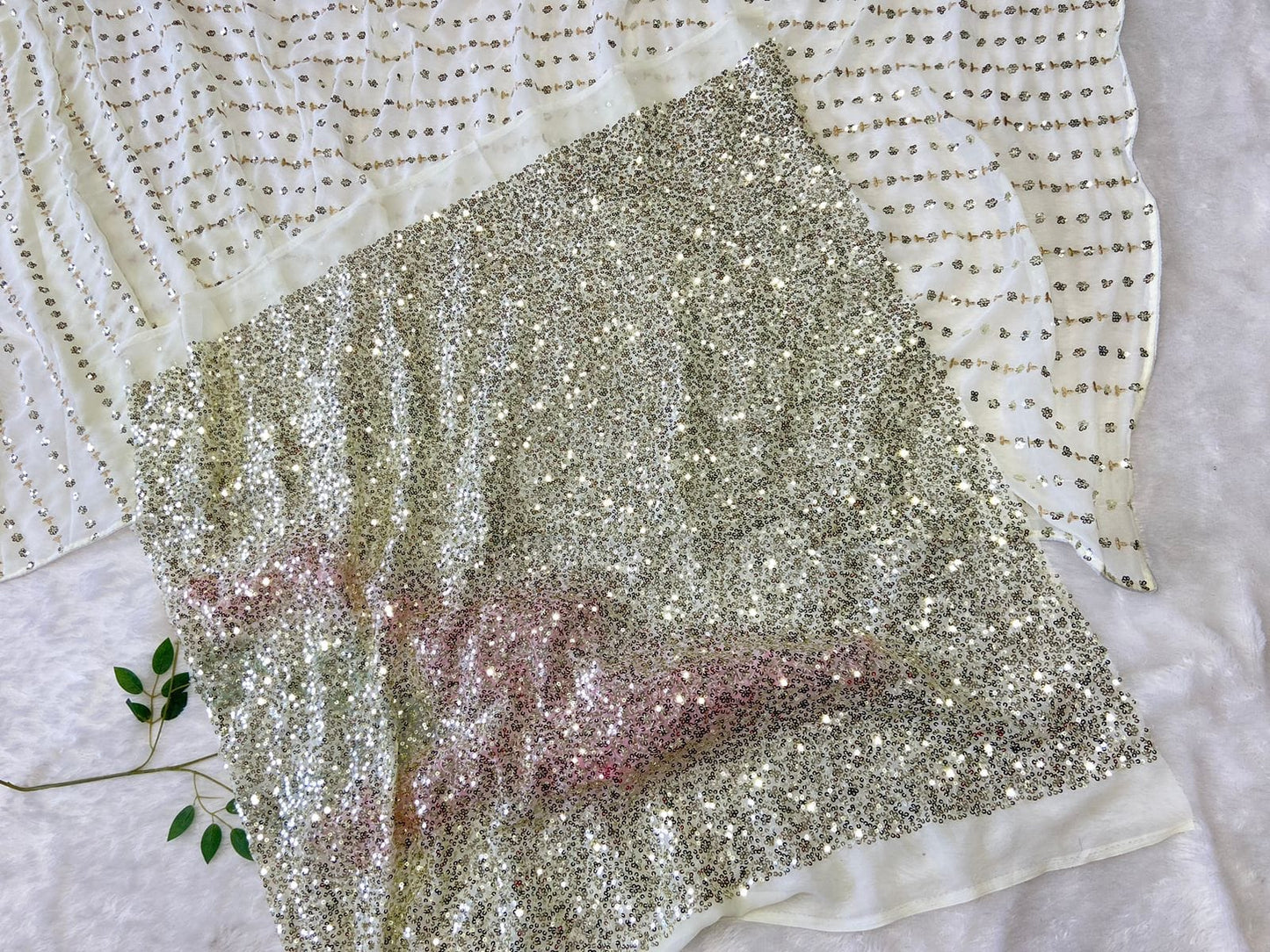 White saree with gold sequins work and heavy blouse piece